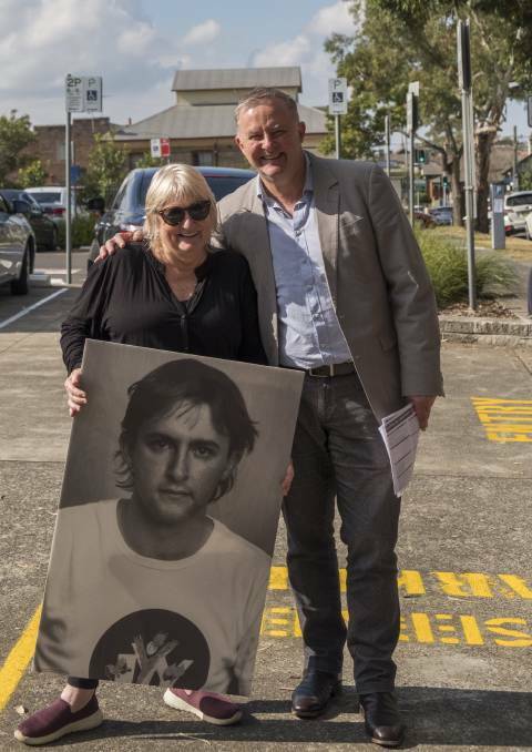 BORN AND BRED: Albanese on election day 2019 in Leichhardt, with a family friend holding a picture that went viral as 'Hot Albo'. Picture: Rod Smith