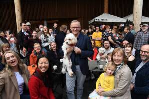 NEW DAY DAWNS: The Prime Minister Mr Albanese on Sunday in Marrickville with Toto and (at far left) Jodie Haydon. Picture: Getty Images
