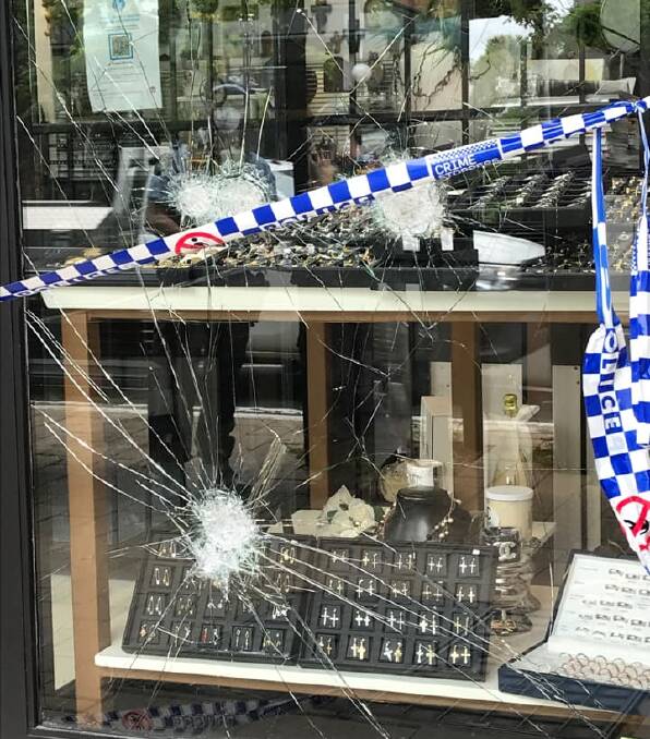 BROAD DAYLIGHT: Witnesses say a person wearing a balaclava attempted to smash the windows of the store before fleeing the scene. Picture: Facebook/ Maria Horvath