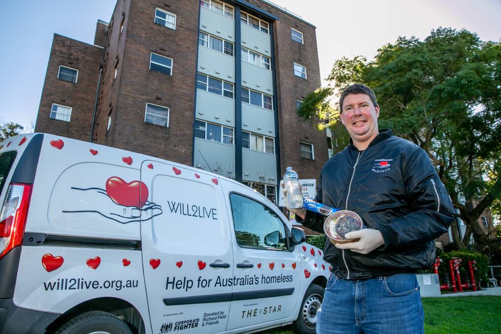 HELPING HAND: Will Hawes at the social housing block in Lilyfield he delivers food to. Picture: Geoff Jones