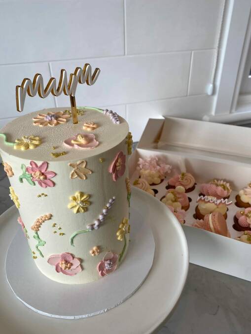 CAKE CREATIONS: A mother's day cake and a box of mother's day cupcakes made by Molly's Kitchen. Picture: Supplied