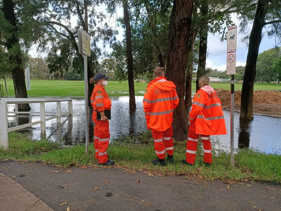 'HARD WORK AND COMPASSION': SES volunteers inspect Cooks River levels. Picture: Supplied