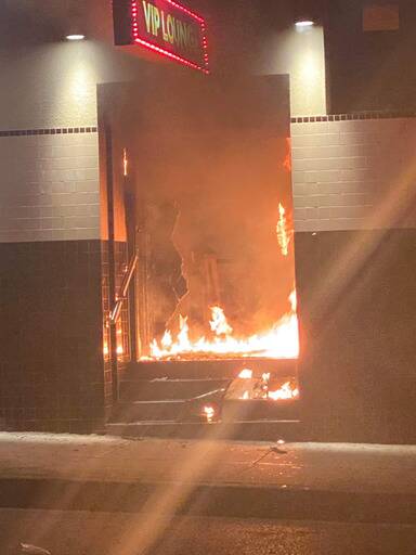 'BRAZEN ATTACK': The stairwell of the hotel was engulfed in flames meaning people upstairs had to escape over the awning. Picture: Facebook/Michael Le