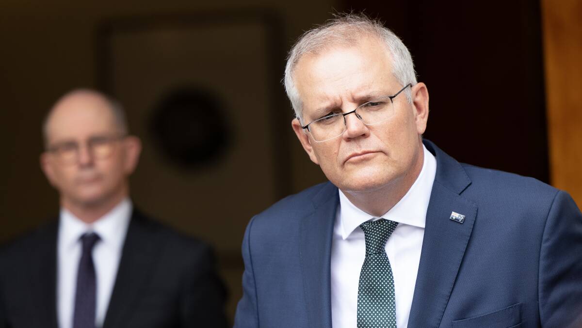 Prime Minister Scott Morrison (right) and Chief Medical Officer Paul Kelly address the media last Thursday. Picture: Sitthixay Ditthavong
