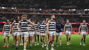 SEASON OVER: A dejected Geelong leave the ground after its preliminary final loss to Melbourne. Photo: Daniel Carson/AFL Photos via Getty Images